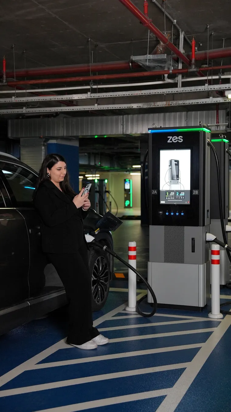 A Zes 720 kW charging station in a car park, a driver charging their car